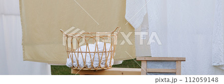 Banner laundry drying in garden setting. 112059148