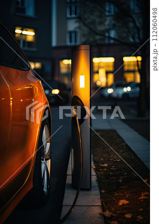 Charging station for electric cars on city street. 112060498