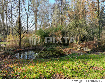 Enlgish green garden with water pound and multpiple type of trees and plants 112060717