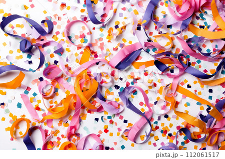 Colorful streamers and confetti scattered over a surface, suggesting a celebration or party atmosphere. Colorful streamers and confetti scattered over a surface, suggesting a celebration or party atmosphere. 112061517