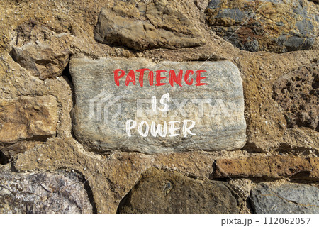 Patience is power symbol. Concept words Patience is power on beautiful big grey stone. Beautiful stone wall background. Business and patience is power concept. Copy space. Patience is power symbol. Concept words Patience is power on beautiful big grey stone. Beautiful stone wall background. Business and patience is power concept. Copy space. 112062057