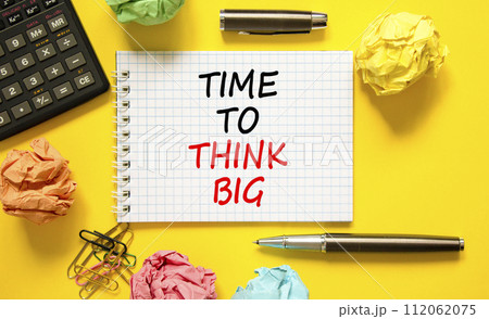 Time to think big symbol. Concept words Time to think big on beautiful white note. Beautiful yellow background. Calculator. Business and time to think big concept. Copy space. Time to think big symbol. Concept words Time to think big on beautiful white note. Beautiful yellow background. Calculator. Business and time to think big concept. Copy space. 112062075