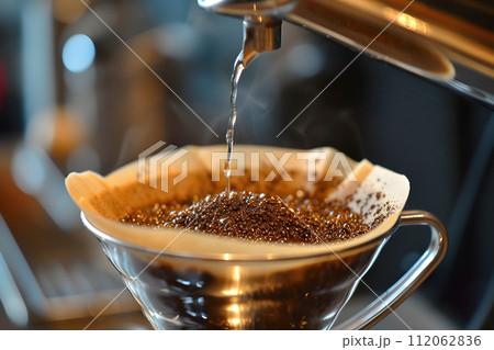 Pouring Essence: Diligent Drip Coffee Machine in Action 112062836