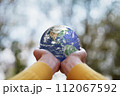ESG , Environmental, Social and Governance concept. A globe in human hands showing support and protection. Elements of this image furnished by NASA. 112067592