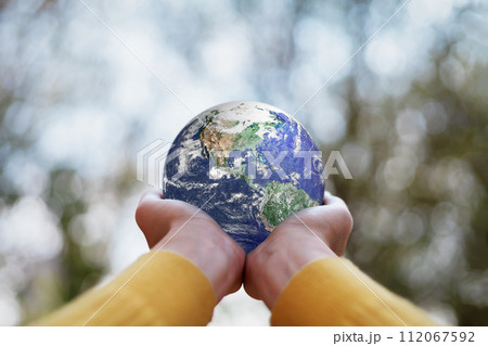 ESG , Environmental, Social and Governance concept. A globe in human hands showing support and protection. Elements of this image furnished by NASA. ESG , Environmental, Social and Governance concept. A globe in human hands showing support and protection. Elements of this image furnished by NASA. 112067592