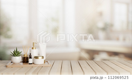 A set of facial cream and a presentation space on a wooden desk in a modern white bathroom. A set of facial cream and a presentation space on a wooden desk in a modern white bathroom. 112069525