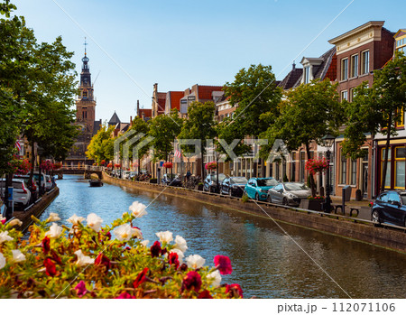 Summer Alkmaar cityscape along Mient canal with Waag building 112071106
