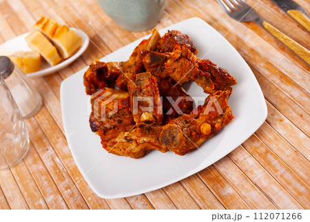 Fried pork ribs served on platter Fried pork ribs served on platter 112071266