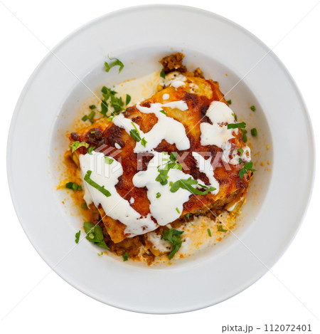 Traditional Italian dish is lasagna baked in oven under cheese crust. Traditional Italian dish is lasagna baked in oven under cheese crust. 112072401