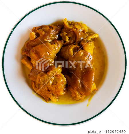 Stewed pork leg in sauce served on plate 112072480