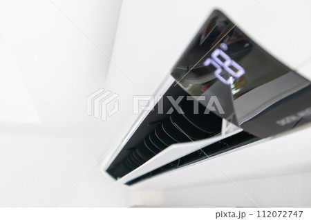 Air conditioner on white wall room interior background Air conditioner on white wall room interior background 112072747