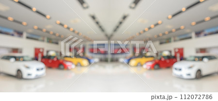 new cars in showroom interior blurred abstract background new cars in showroom interior blurred abstract background 112072786