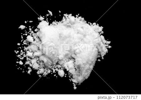 White snow isolated on black background close up White snow isolated on black background close up 112073717