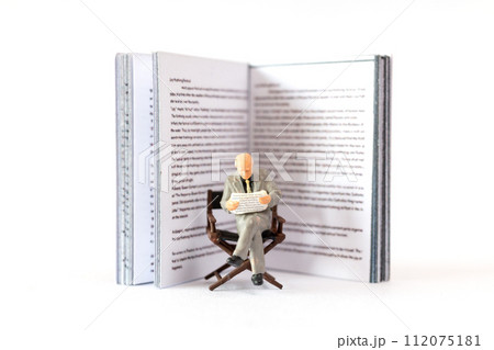 World Book Day concept, Miniature people elderly guy reading a book alone 112075181