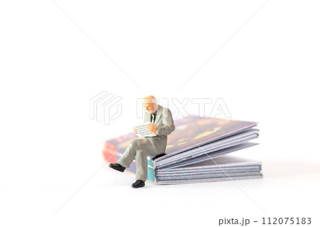 World Book Day concept, Miniature people elderly guy reading a book alone 112075183