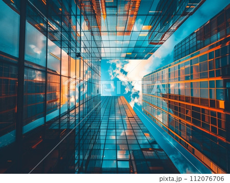 Urban Skyline Modern Office Building Reflecting Cityscape in Glass  112076706