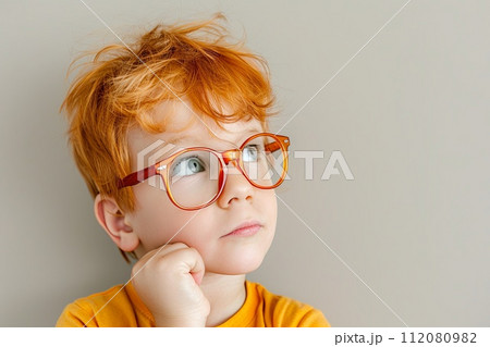 Young Boy With Red Hair Wearing Glasses Young Boy With Red Hair Wearing Glasses 112080982