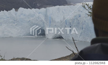 Unidentified Tourist Admiring the Majestic Perito Moreno Glacier 112082948
