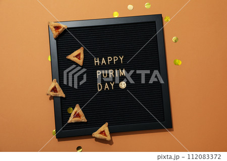 A mask with traditional cookies for the day of Purim. A mask with traditional cookies for the day of Purim. 112083372