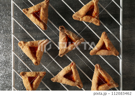 A mask with traditional cookies for the day of Purim. A mask with traditional cookies for the day of Purim. 112083462