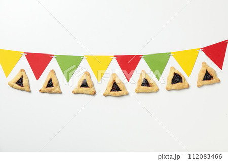 A mask with traditional cookies for the day of Purim. A mask with traditional cookies for the day of Purim. 112083466
