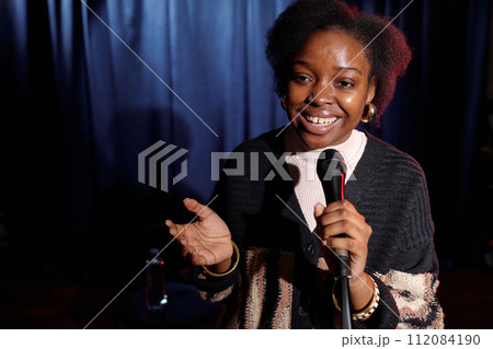 Happy young comedian of modern stand up 112084190
