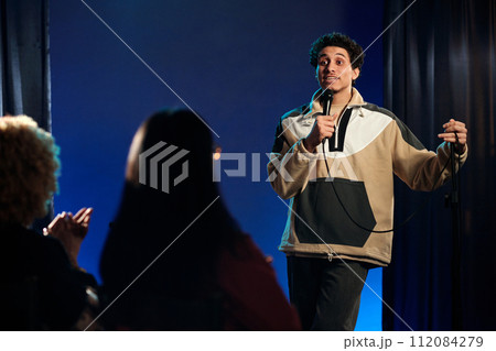Young comedian standing on stage Young comedian standing on stage 112084279