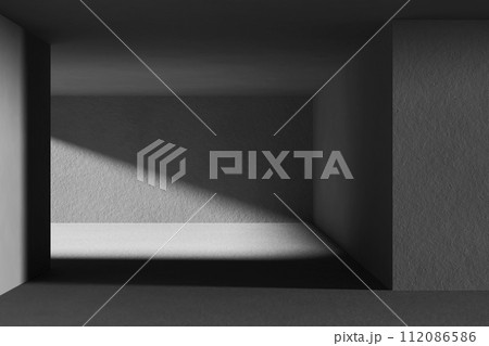 A black and white background with light coming through the building structure. 112086586