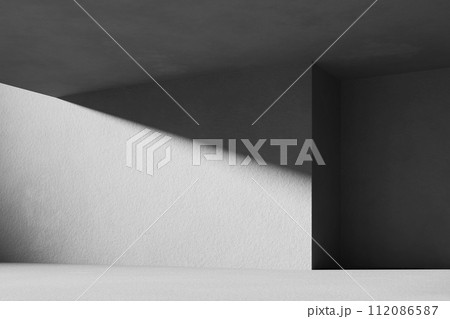 A black and white background with light coming through the building structure. 112086587