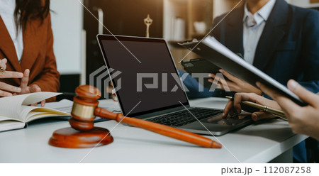 Businessman and Male lawyer or judge consult having team meeting with client, Law and Legal services concept in office. Businessman and Male lawyer or judge consult having team meeting with client, Law and Legal services concept in office. 112087258