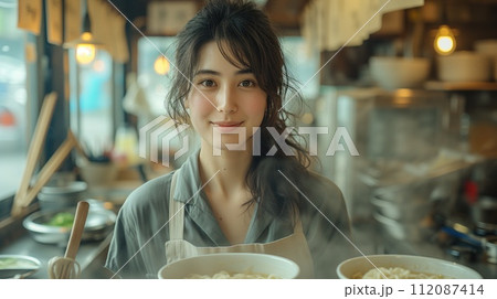 young asian woman cooking in the kitchen 112087414