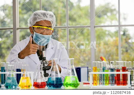 Scientist in Lab Coat Gives Thumbs Up for Positive Results; Celebrating Scientific Achievement Scientist in Lab Coat Gives Thumbs Up for Positive Results; Celebrating Scientific Achievement 112087416