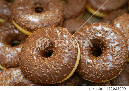 assorted donuts with chocolate frosted and glazed in the grocery store 112088090