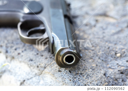 Handgun On Stone 112090562