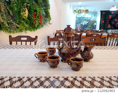 underground hall of the restaurant decorated in the national Moldavian style underground hall of the restaurant decorated in the national Moldavian style 112092463