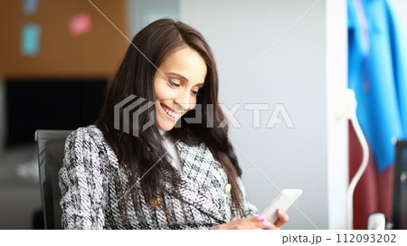 Cheerful lovely lady with mobile phone 112093202