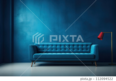 a blue couch next to blue walls a blue couch next to blue walls 112094522