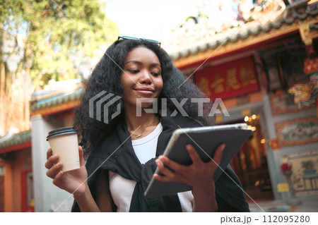 Asian woman enjoy travel in  downtown district 112095280
