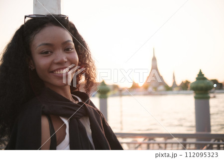 Asian woman enjoy travel in  downtown district 112095323