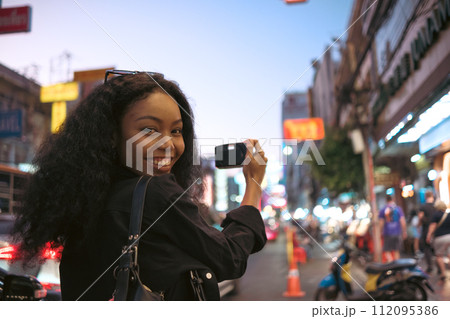 Asian woman enjoy travel in downtown district Asian woman enjoy travel in downtown district 112095386