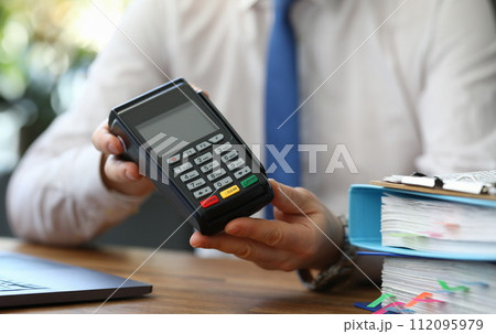 Seller in presentable suit in office Seller in presentable suit in office 112095979