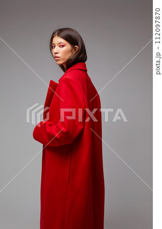 Fashion asian female model in red coat. 112097870