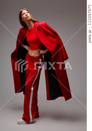 Fashion asian female model in red coat. 112097875