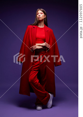 Fashion asian female model in red coat. 112097885