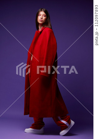 Fashion asian female model in red coat. Fashion asian female model in red coat. 112097893