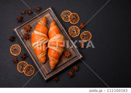 Delicious fresh, crispy French croissants with sweet filling Delicious fresh, crispy French croissants with sweet filling 112100163