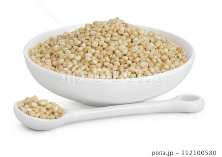 Sorghum seeds in ceramic bowl and spoon isolated on white background with full depth of field. 112100580