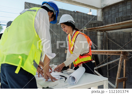 businesswoman hands using a calculator to check company finances and earnings and budget 112101374