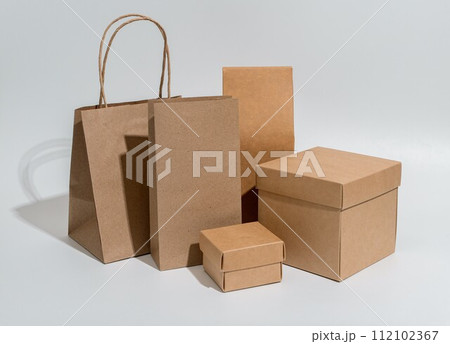 Kraft packages, boxes, bag, brown beige packs for gifts, purchases set Kraft packages, boxes, bag, brown beige packs for gifts, purchases set 112102367