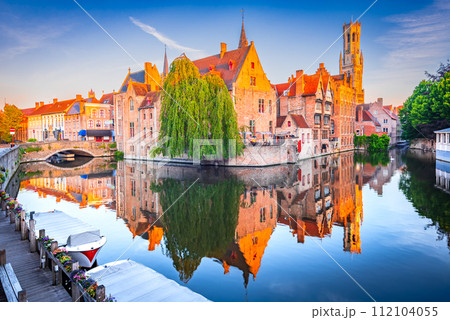 Bruges, Belgium. Rozenhoedkaai Canal in downtown of Brugge, sunrise colors. Famous Flanders destination. Bruges, Belgium. Rozenhoedkaai Canal in downtown of Brugge, sunrise colors. Famous Flanders destination. 112104055